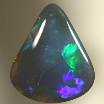 SOLID BLACK OPAL Two large rolling flashes of neon greens to ultra violet. SEE VIDEO